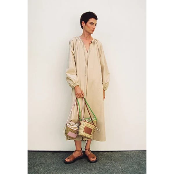 model in sand maxi dress