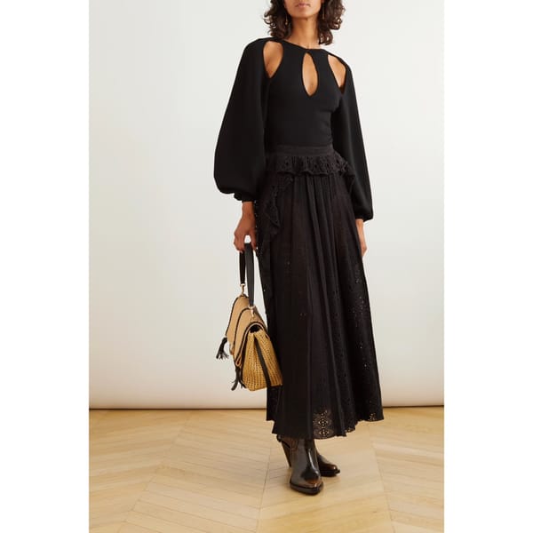 model wears black Cutout wool-blend blouse