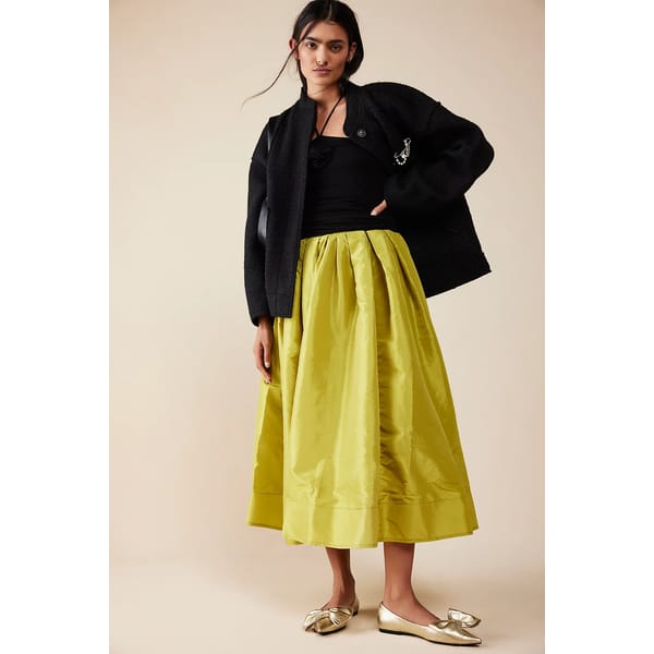 model in full yellow/green skirt