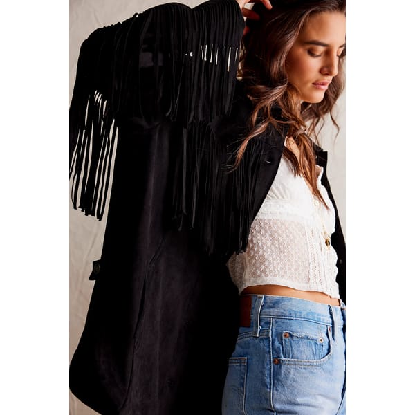 model wearing black suede fringed jacket