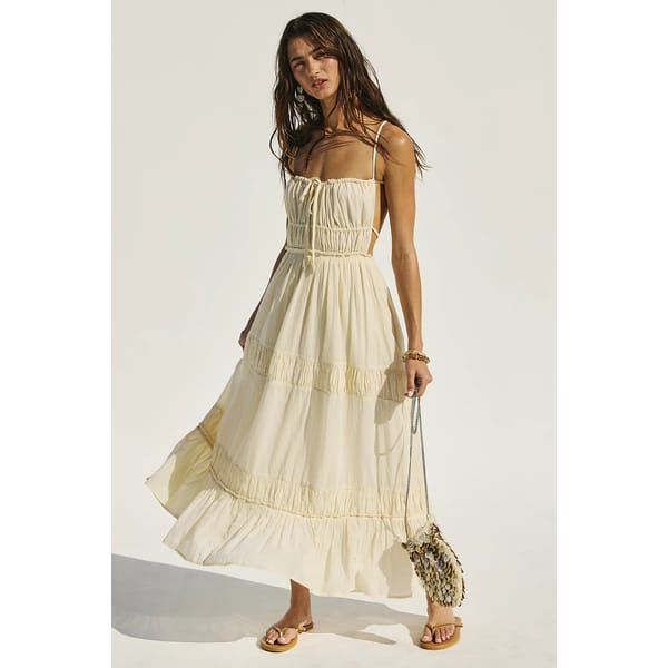 model in yellow ruffled dress