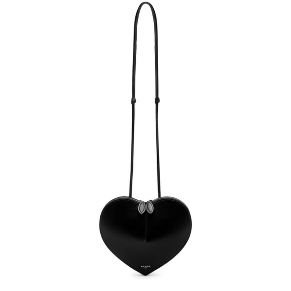 black leather bag in heart shape