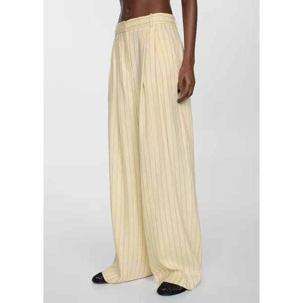 model wears linen blend stripe trousers