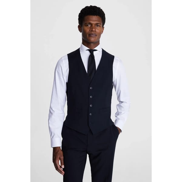 male model wears Tailored Fit Black Performance Suit