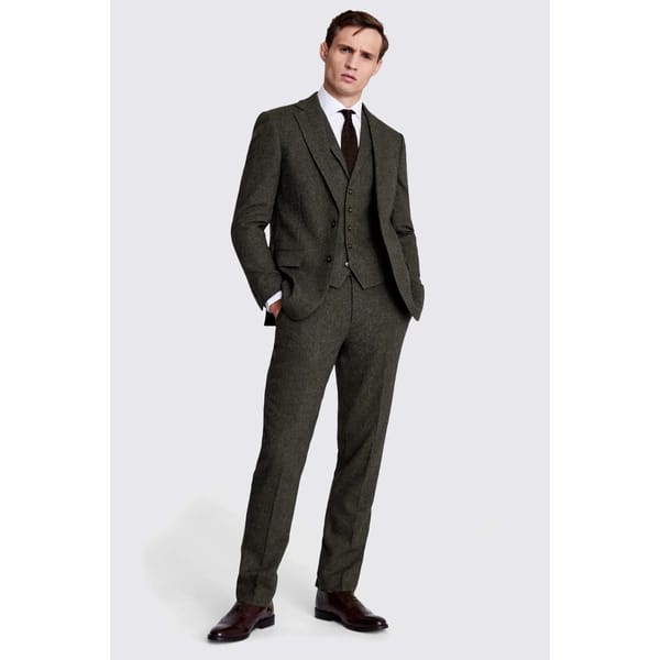 male model wears Tailored Fit Olive Herringbone Suit