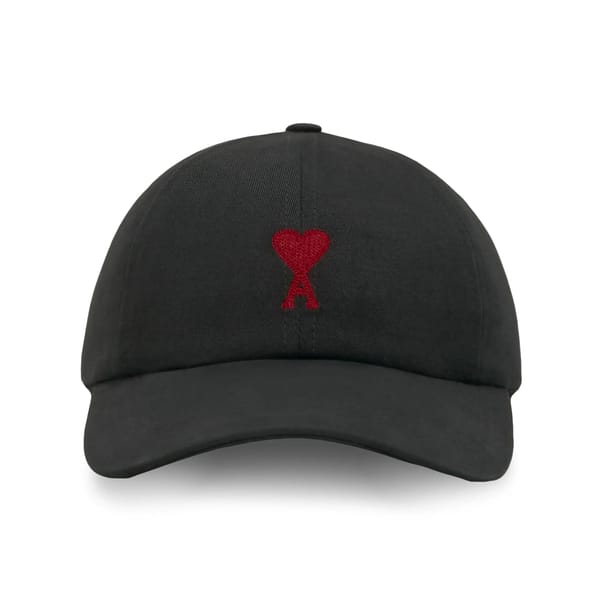black cap with heart logo
