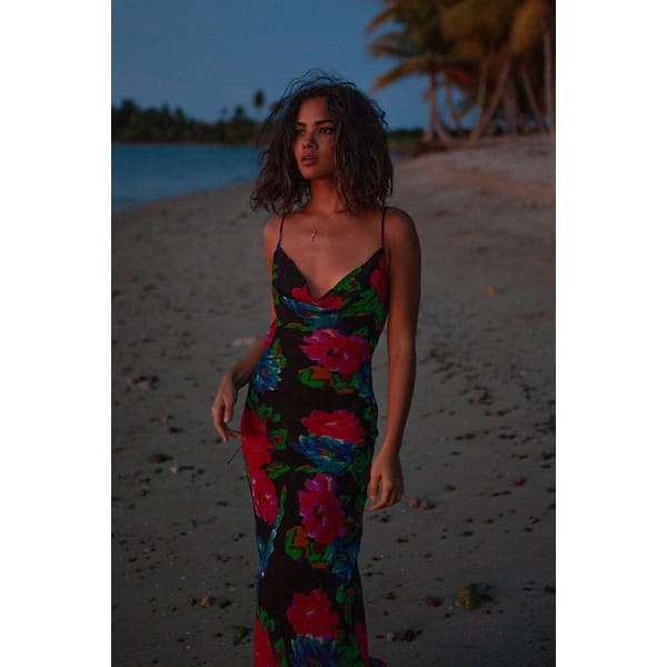 model on beach wearing floral maxi dress