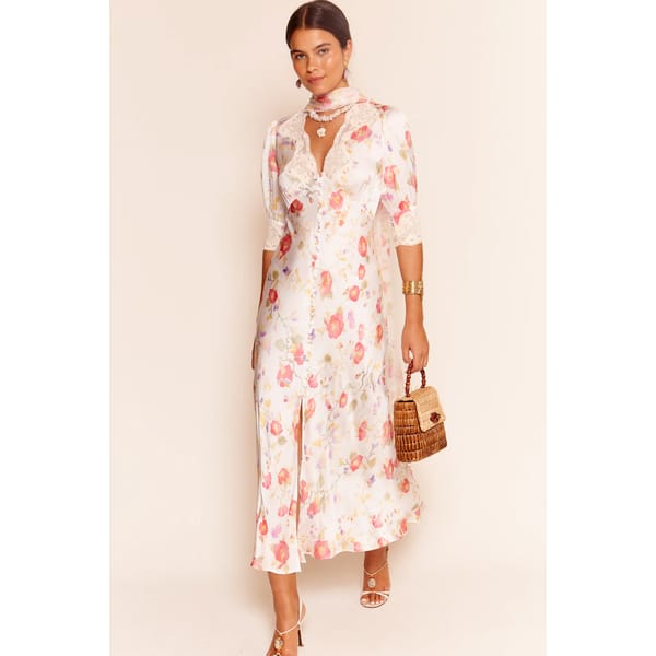 model wears white and pink RIXO Simone Midi Dress in floral print