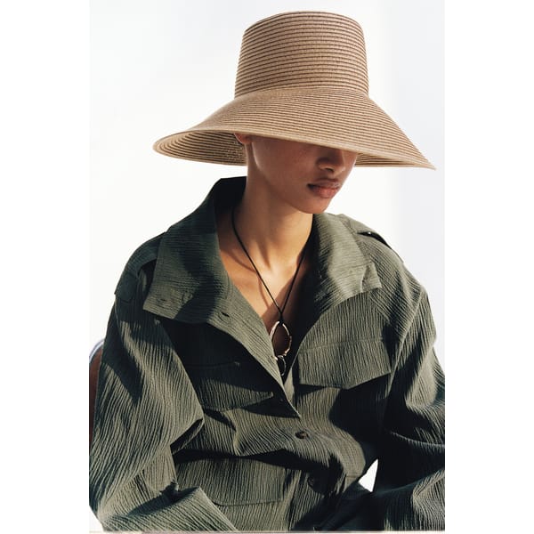 MODEL WEARS Sloping-brim straw hat