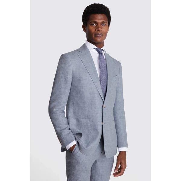 male model wears Tailored Fit Light Blue Linen Suit