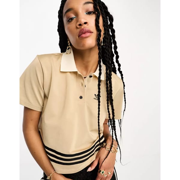 model wears adidas Originals football shirt in. beige