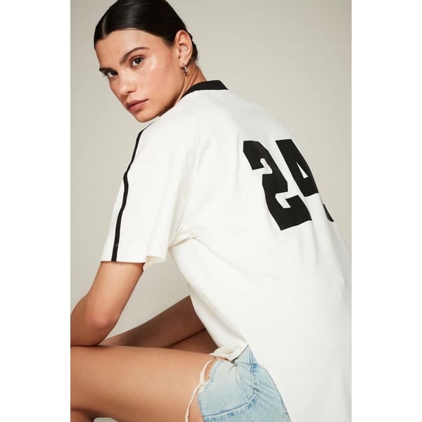 model from back wearing Active Football Graphic T-Shirt