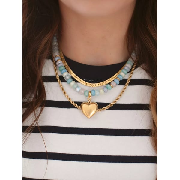 close up of model wearing BRINKER AND ELIZA beaded heart necklace