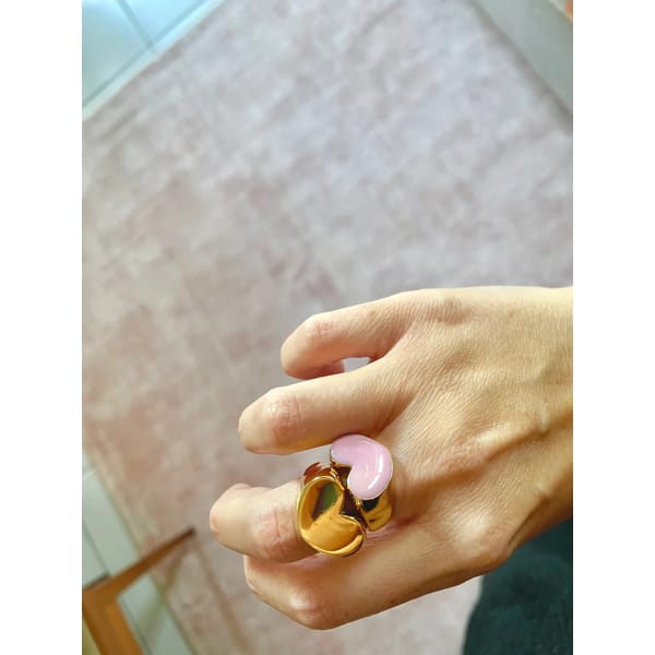 pink heart ring on hand