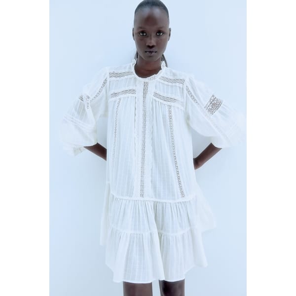 model wearing white hm Lace-trimmed cotton dress