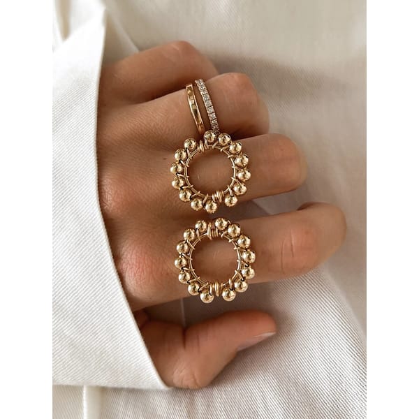 large round rings on hand