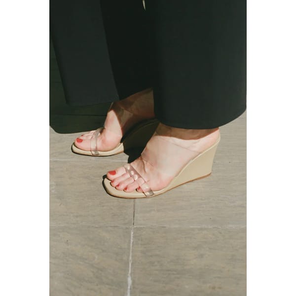 close up of feet wearing Olympia Wedges In Toffee Calf