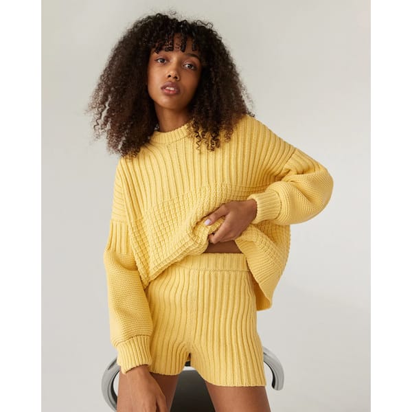 model wearing lemon knitted co-ord