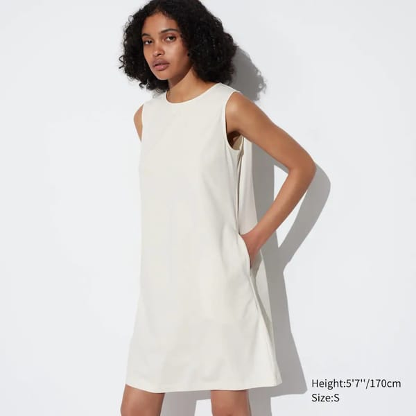 model wears white mini dress