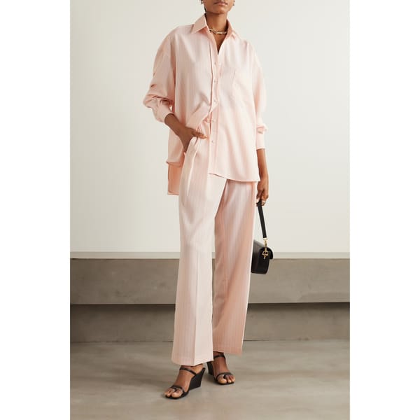 model wearing NAP THE FRANKIE SHOP Tansy pleated pinstriped crepe de chine straight-leg pants and shirt