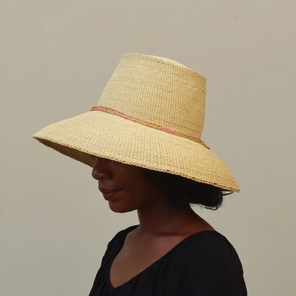 model wearing straw hat