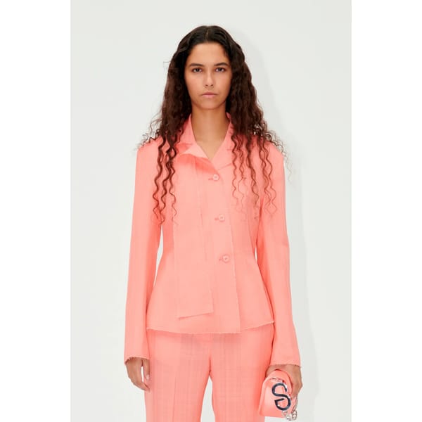 model wearing coral jacket