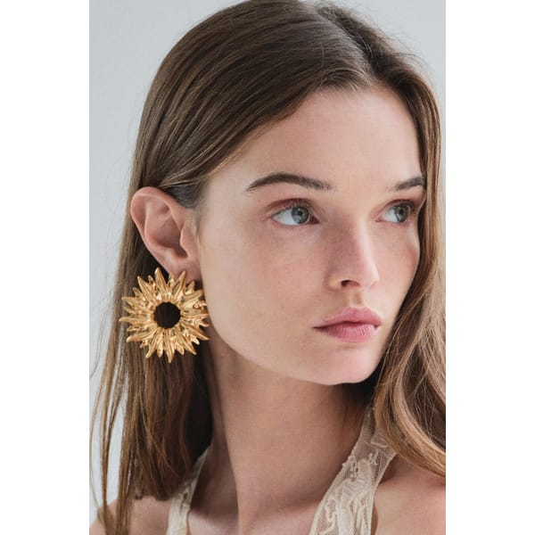 model wearing ZARA METAL SUN EARRINGS