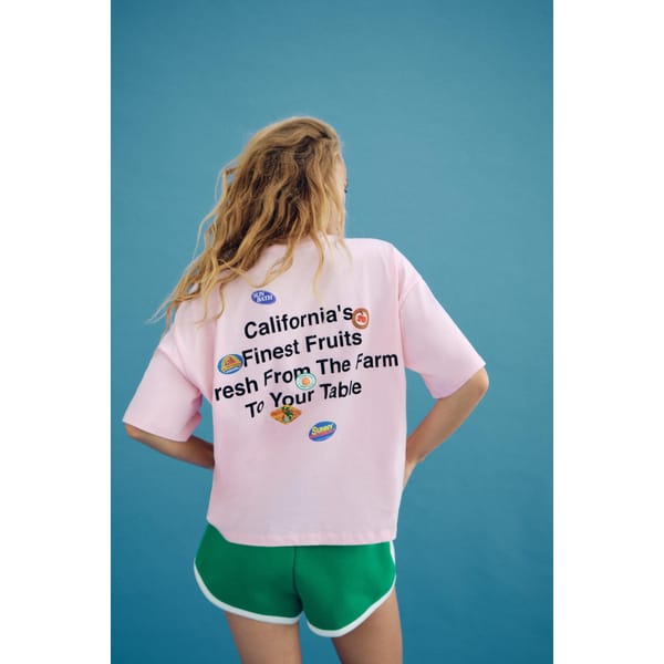 model from back wearing zara STICKERS PRINT T-SHIRT WITH SLOGAN