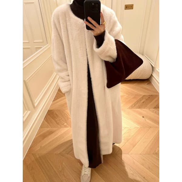 model taking picture in mirror wearing MARCELA Anya Faux Fur Coat Snow