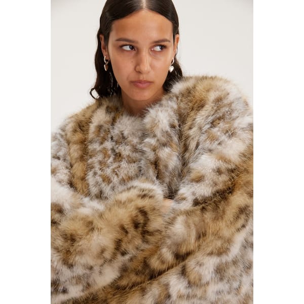 model wears MONKI Short Faux Fur Jacket