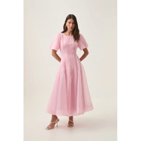 model wearing pink pleated midi dress