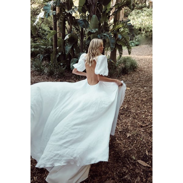 model running from back in wedding dress