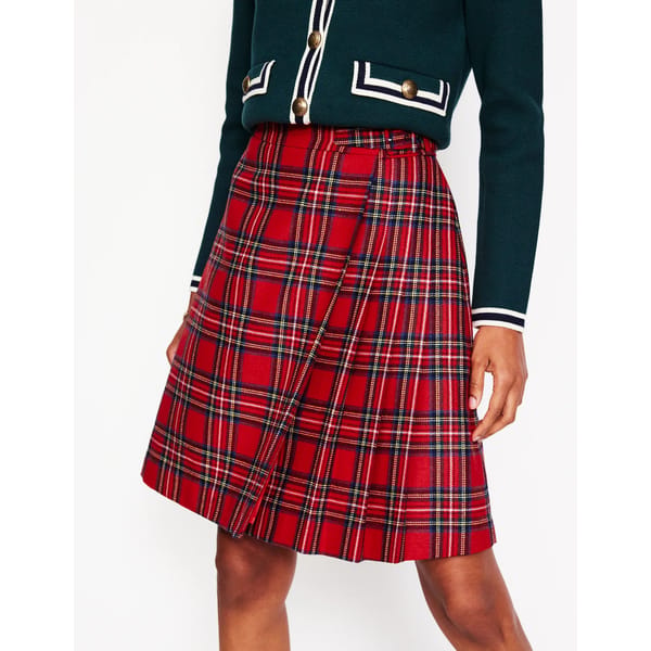 close up of model wearing red tartan kilt