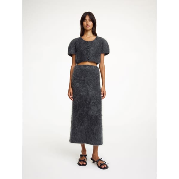model wearing grey wool skirt co-ord set