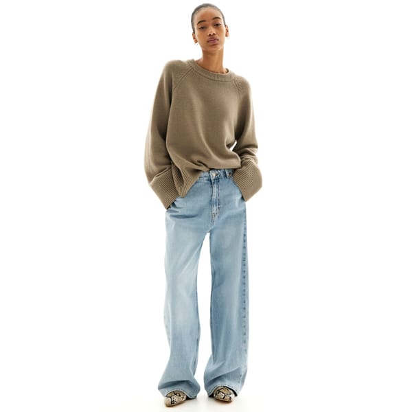 model wears Cashmere-blend jumper and jeans