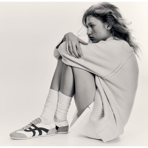 model sitting wearing Cashmere-blend turtleneck jumper