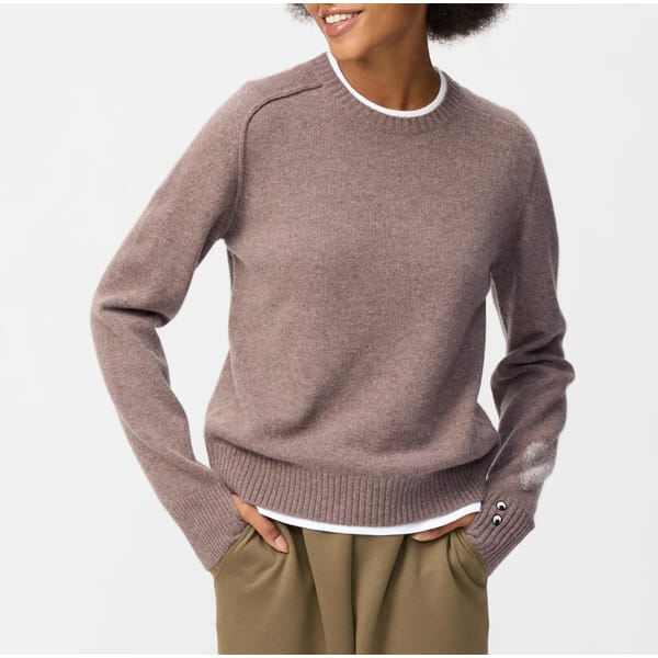 model wears cashmere jumper in biscuit