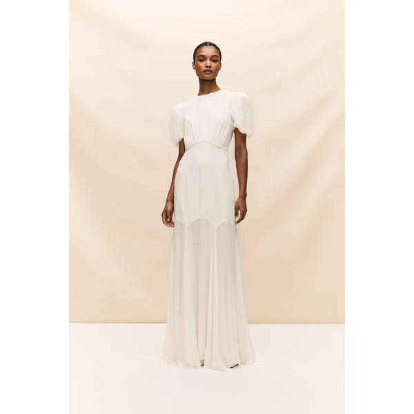 model wearing ivory silk.chiffon wedding dress