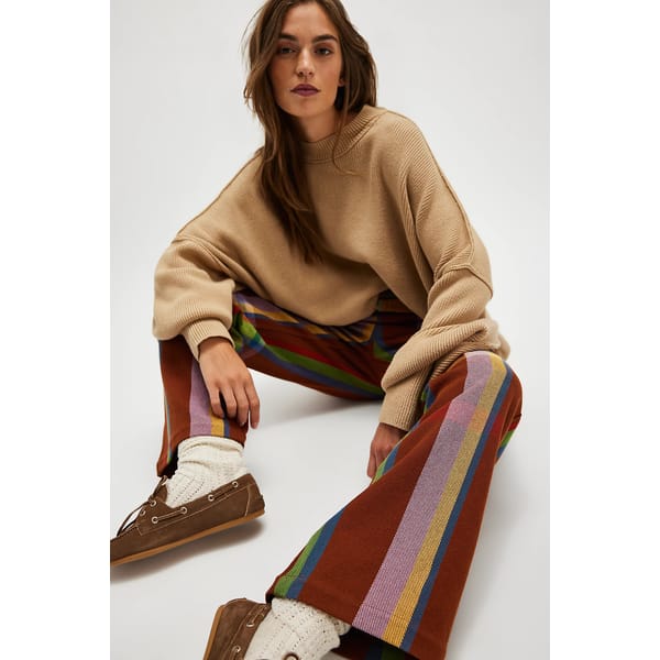 model wearing oversized tartan print trousers