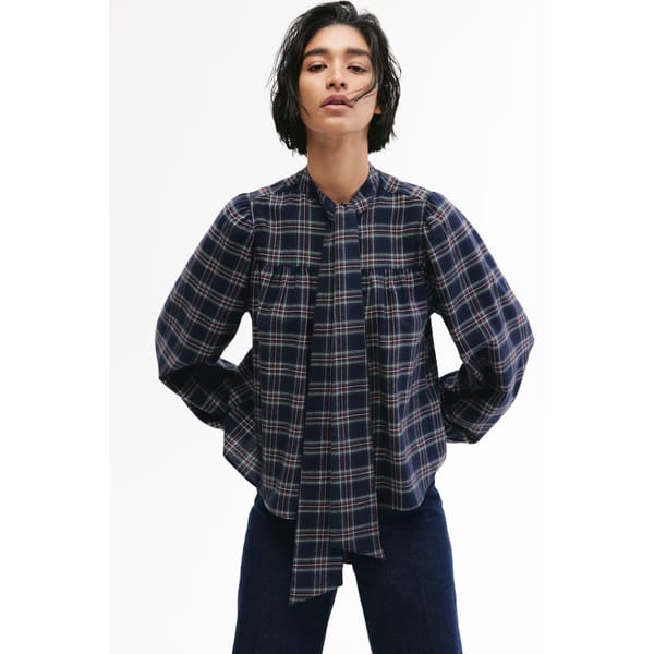 model wearing H&M Tie-neck cotton blouse