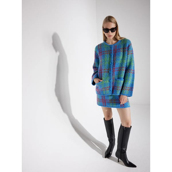 model wearing KITRI Susan Blue Check Boucle Knit Mini Skirt and jacket