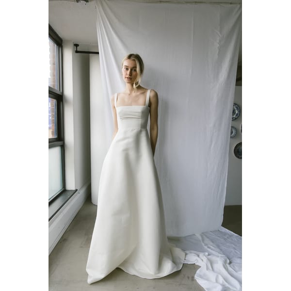 model wearing mae white long wedding dress