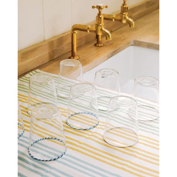 striped tea towels by kitchen sink