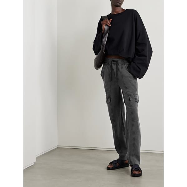 model wearing NAP MARANT ÉTOILE Peorana cotton-jersey track pants in grey