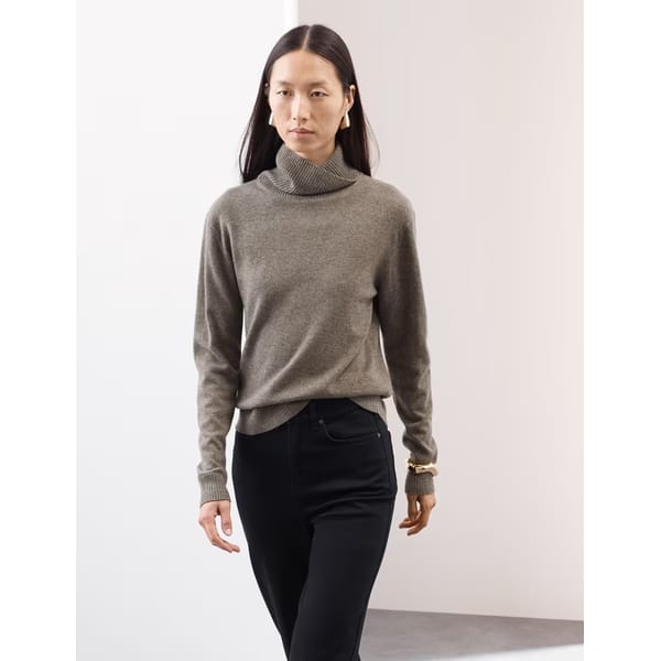 model walking wearing Pure Cashmere Roll Neck Jumper