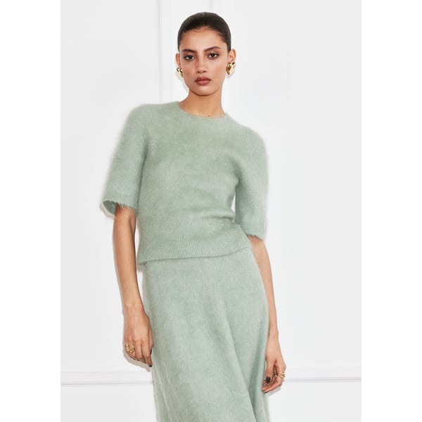 model wearing pale green STOREIS Brushed-Knit T-Shirt