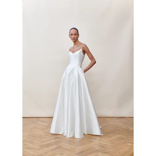MODEL WEARING WHITE SILK MIKADO GOWN