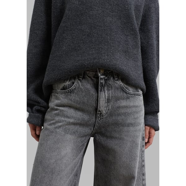 close up of model wearing THE FRANKIE SHOP Alani Wide Leg Jeans - Black Wash