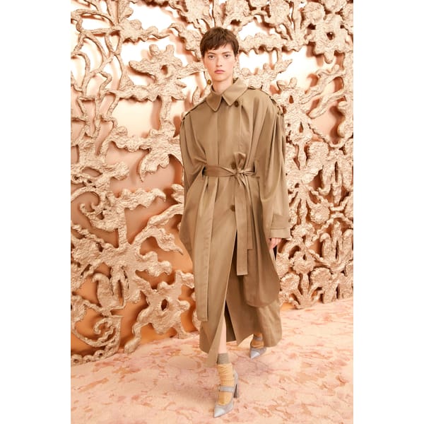 model wearing oversized trench coat