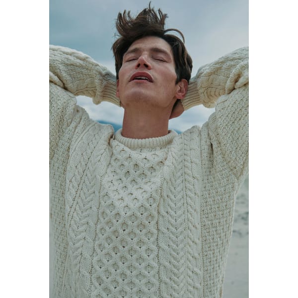 male model wearing AARON WOOLLEN MILLS Inisheer Traditional Mens Aran Sweater - Cream